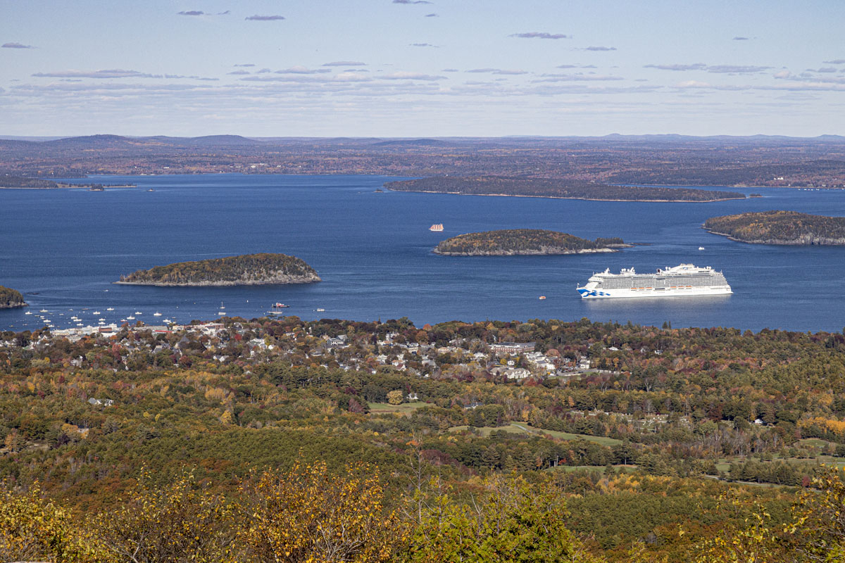 The cruise ship 'Adventure of the Seas' is visible from halfway up Cadillac Mountain. The four masted schooner Margaret Todd can also be seen just beyond an island. [O15R2500]