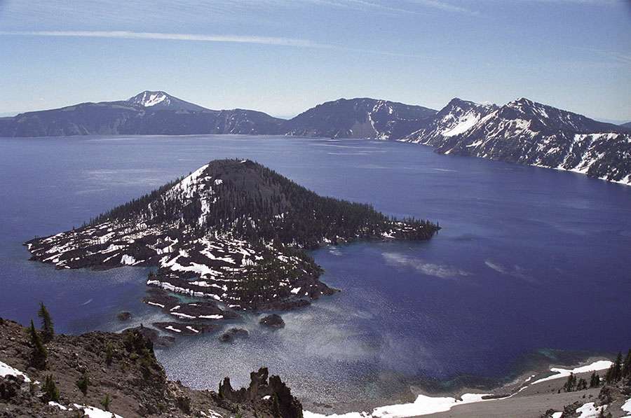 We first visited Crater Lake in mid June 2002 when the rim road was still closed by snow. In August 2005 we were able to drive the entire 33 mile rim drive. The elevation of the drive varies from about 6,000 to 8,000 feet.The lake was formed 7,700 years ago when Mount Mazama blew its top and ejected 150 times as much 'stuff' as Mount St. Helens did. The area was designated a national park on May 22, 1902.