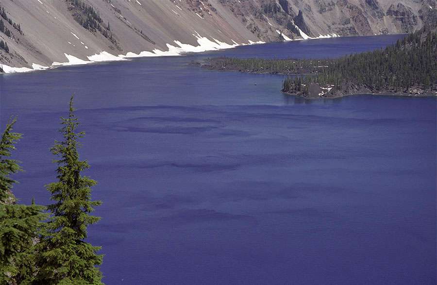 Wind patterns in the water makes it look like the water is 'piled up' in some places. The surface of the lake is about 6,173 feet above sea level.