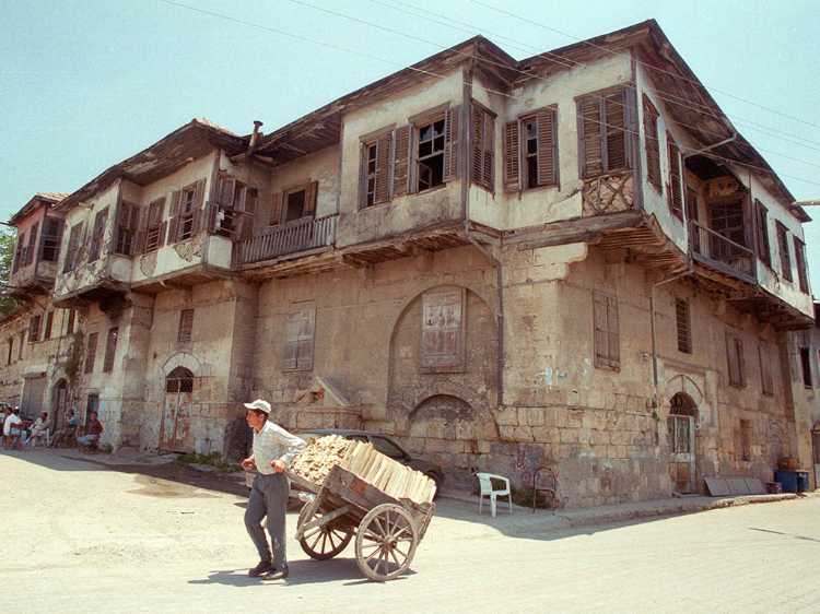 This man with a cart full of wood in front of the old Ottoman style house was much more picturesque than St. Paul's well.