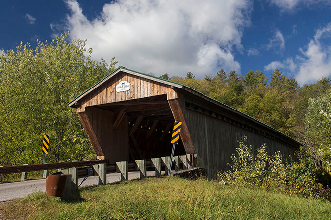 The Gorham Covered Bridge in Pittsford, Vermont is a 114 foot span over Otter Creek. It was built in 1842 by Nicholas Powers and Abraham Owens.