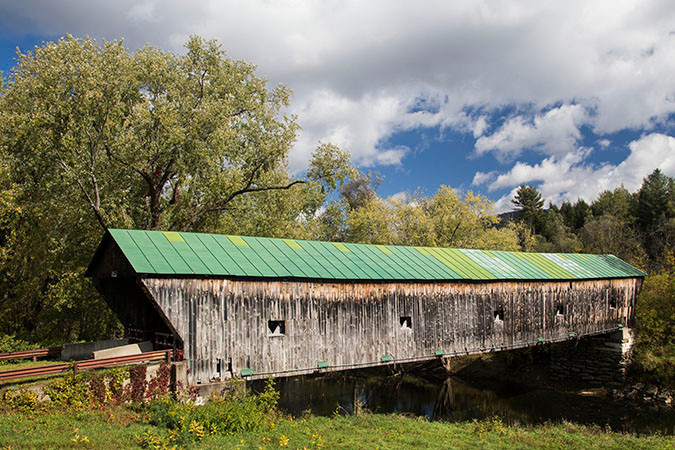 The Hammond Covered Bridge is one of four covered bridges in the town of Pittsford, Vermont. This 139 foot Town lattice truss bridge was built in 1842 by Asa Nourse. During the 1927 flood the bridge floated off its abutments and ended up in a field over a mile down stream. During the winter of 1927-28 the town returned the bridge to its former location.